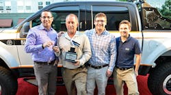 Mark Klein, president of sales &amp; marketing at Klein Tools, presents the truck keys to Joey Hall, owner of Diamond Electric, and Klein&apos;s 2015 Electrician of the Year, in the company of David Klein, product manager at Klein Tools, and Thomas R. Klein Jr., president of operations research &amp; development.
