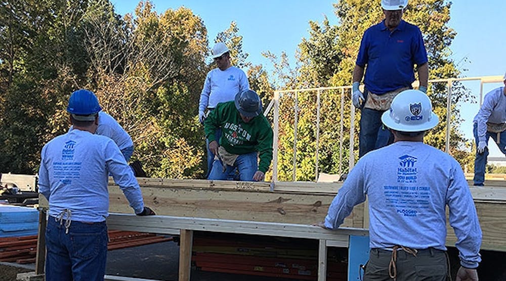 A hundred associates from Shealy Electrical Wholesalers built a home for Habitat for Humanity in the parking lot of its Charlotte, N.C., location and transported it to a neighborhood three miles away.