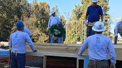 A hundred associates from Shealy Electrical Wholesalers built a home for Habitat for Humanity in the parking lot of its Charlotte, N.C., location and transported it to a neighborhood three miles away.