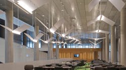 A look inside Syracuse University&rsquo;s new School of Law, Dineen Hall. This collaborative working area is adjacent to the school&rsquo;s main library. The luminaires represent flying books that create a unique look hanging over the tables. O&rsquo;Connell Electric was the electrical contractor for the project, which spanned all of 2014. The 200,000-square-foot facility features an open architecture design, collaborative learning spaces, and state-of-the-art technology.