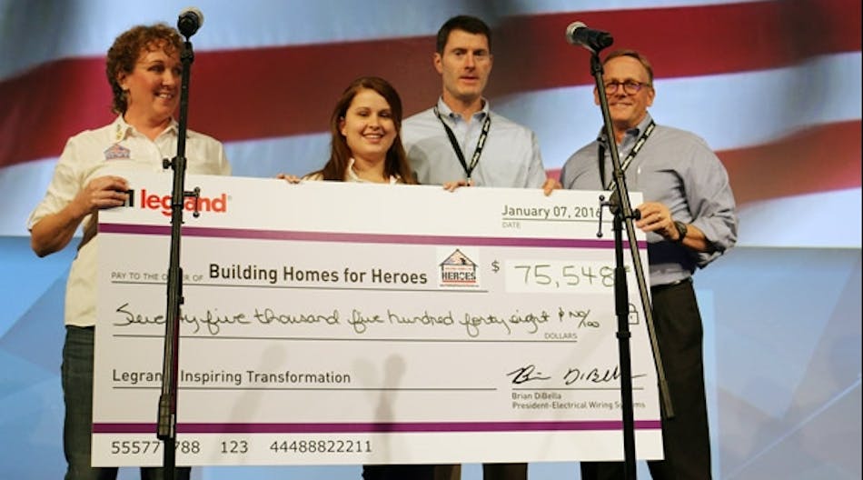 Building Homes for Heroes representatives (left-right) Kim Valdyke, Florida event planner and volunteer coordinator, and Lindsay Morris, event coordinator, receive a check from Brian DiBella, president, Legrand&apos;s Electrical Wiring Systems Division and Tom Lowery, president, Legrand&apos;s Building Controls Systems Division during the Legrand sales meeting.
