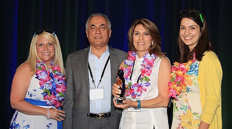 Angie Prost (left), Lighting One product and supplier manager; Fred Farzan, Nora Lighting CEO and president; Jilla Farzan, Nora Lighting executive vice president; and Madie Young, Lighting One marketing associate.