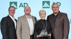 Dave Kinsella, AD (left) and AD&rsquo;s Ed Crawford (right), present Drew Esce, Sandy Rosecrans of City Electric, Syracuse, N.Y., with AD&apos;s U.S. Member of the Year, Performance &ndash; Over $10 million.