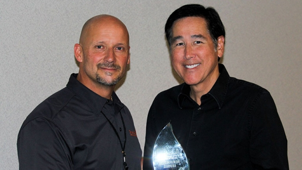 Matt Hartmann left president and CEO of Tour de Force presented Dennis Guey Stanion Wholesale Electric39s VP of sales with the software company39s 2016 Award for Best Innovation for the way Stanion uses its systems to track valueadded services