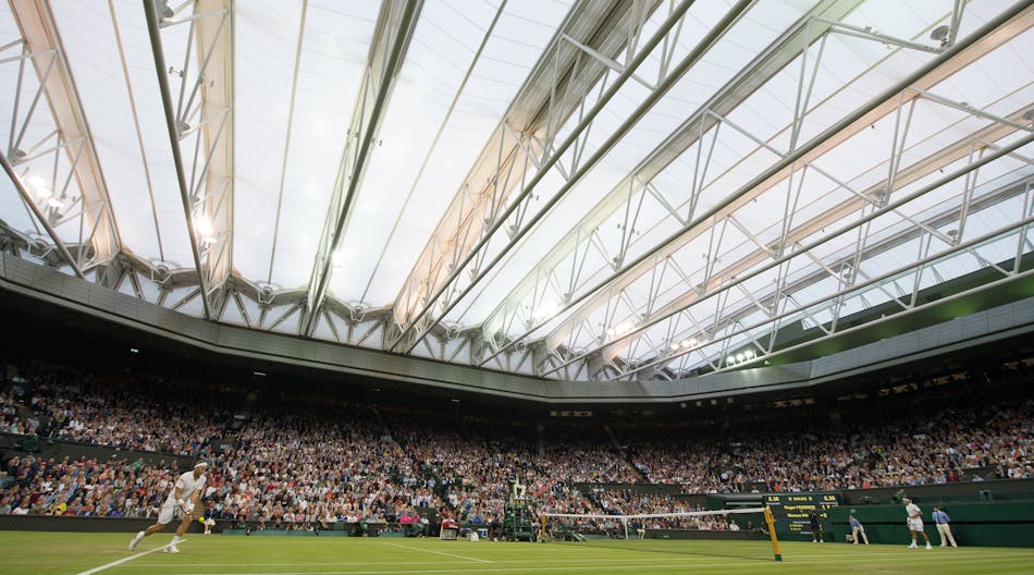 Marcus Willis (GBR) and Roger Federer (SUI) in action under a closed roof in a second round Gentlemen&apos;s Singles match on Centre Court. The Championships 2016 at The All England Lawn Tennis Club, Wimbledon. Day 3 Wednesday 29/06/2016. Credit: AELTC/Thomas Lovelock