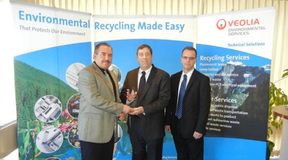 Fred Ribelli, Veolia environmental account manager (left), and Kevin Shaver, Veolia environmental operations manager (right) presented Veolia&rsquo;s Environmental Stewardship Award to Jack Schmid, Crescent Electric Supply product and inventory manager.