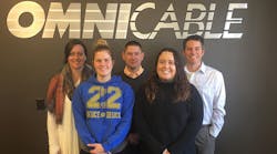 Members of the OmniCares Committee (left to right): Beth Genther, operations specialist; Christa Callahan, health and wellness manager; Emmett Mauer, account manager; Mattie Siegfried, real estate manager; and Bill Blank, senior product manager.