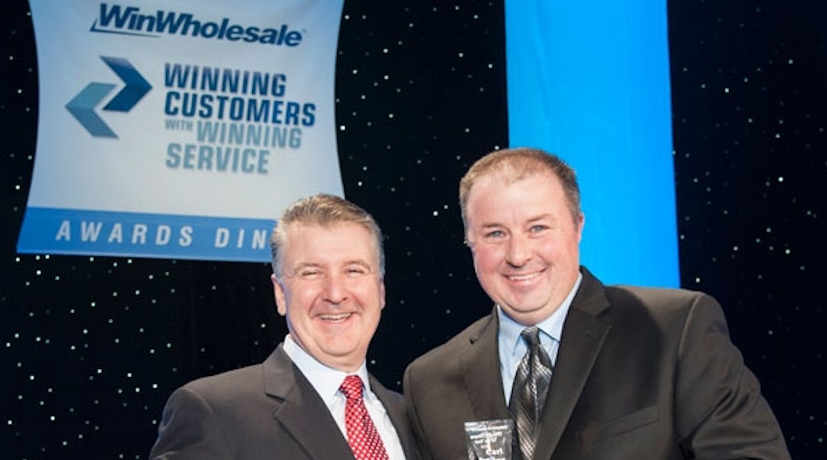 Monte Salsman, WinWholesale COO (left), presented the award to Carl Long, president of Odessa Winlectric, at WinWholesale&apos;s 2014 Annual Meeting and Vendor Showcase awards dinner. The event drew 1,200 WinWholesale associates and vendors in Grapevine, Texas, March 18.