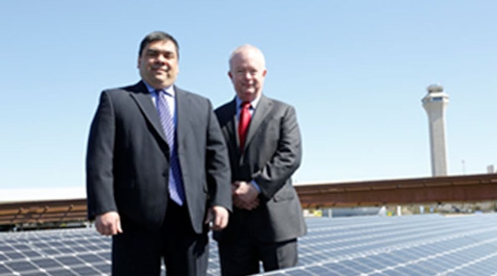 Jim Heitmann, acting general manager of Newark Liberty International Airport and Michael Gibson, vice president for energy services at ConEdison Solutions, atop one of Newark Liberty International Airport&apos;s four solar rooftops.