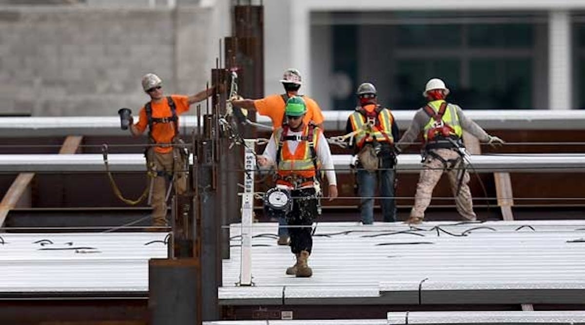 Construction workers build the $1.05 billion Brickell CityCentre condo/retail mix use complex on July 7, 2014 in Miami, Florida. Condo projects are booming in the South Florida area as foreign investors pour money into the new residences being built.