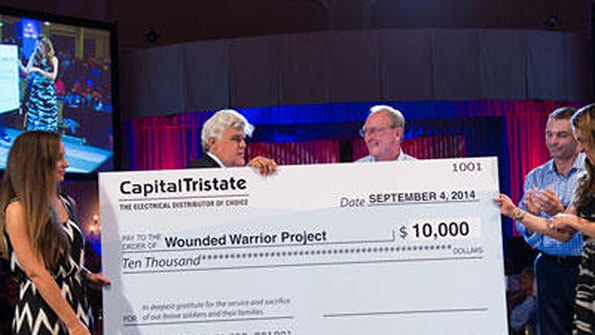 Jay Leno joined CapitalTristate President John Hardy in presenting a donation to the Wounded Warrior Project at a CapitalTristate customer appreciation outing in San Diego last month