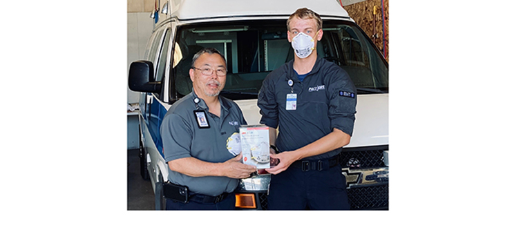 First responder from PACT EMS in Idaho with one of the N-95 masks that was donated by Turtle & Hughes.