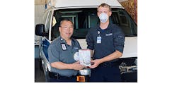 First responder from PACT EMS in Idaho with one of the N-95 masks that was donated by Turtle &amp; Hughes.