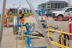 Electrical crews from Cupertino Electric, San Jose, CA, pulling wire at its University of California - Merced 2020 project in California. Electrical crews from Cupertino Electric, San Jose, CA, pulling wire at its University of California - Merced 2020 project in California.
