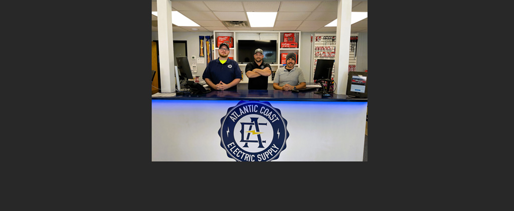 (Left to right) Philip Walker, Jason Hyman and Casey Lever at the counter of Atlantic Coast Electric Supply's new location in North Charleston, SC.